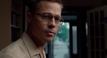 Movie still from “The Tree of Life” (2011), directed by Terrence Malick – A person wearing glasses; Close Up shot, Over the shoulder angle