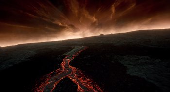 Movie still from “The Tree of Life” (2011), directed by Terrence Malick – An aerial view of a lava flow in the middle of the night; Extreme Wide shot, High angle