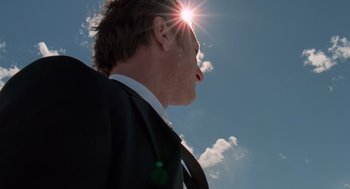 Movie still from “The Tree of Life” (2011), directed by Terrence Malick – A person wearing a suit and tie; Close Up shot, Low angle