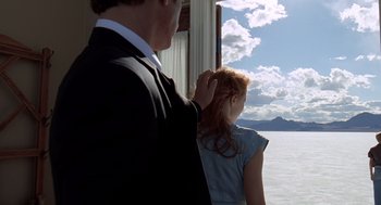 Movie still from “The Tree of Life” (2011), directed by Terrence Malick – A man and a woman looking out of a window; Medium shot, Over the shoulder angle