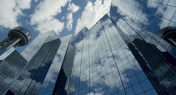 Movie still from “The Tree of Life” (2011), directed by Terrence Malick – A view looking up at the sky through the windows of a skyscraper; Extreme Wide shot, Low angle