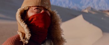 Movie still from “Close Encounters of the Third Kind” (1977), directed by Steven Spielberg – A person wearing a hat and a fur coat; Close Up shot, Low angle