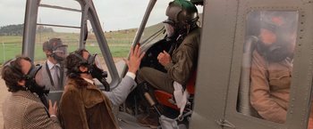 Movie still from “Close Encounters of the Third Kind” (1977), directed by Steven Spielberg – A man sitting in the cockpit of a helicopter; Wide shot, Over the shoulder angle