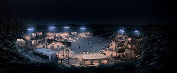 Movie still from “Close Encounters of the Third Kind” (1977), directed by Steven Spielberg – An aerial view of an airfield at night with lights on; Extreme Wide shot, High angle