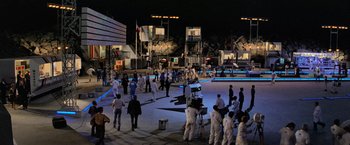 Movie still from “Close Encounters of the Third Kind” (1977), directed by Steven Spielberg – A group of people standing in a field at night; Extreme Wide shot, High angle