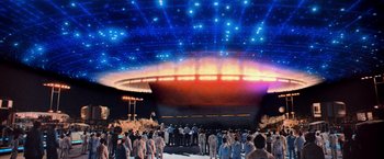 Movie still from “Close Encounters of the Third Kind” (1977), directed by Steven Spielberg – A group of people standing in front of an alien ship; Extreme Wide shot, High angle