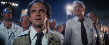 Movie still from “Close Encounters of the Third Kind” (1977), directed by Steven Spielberg – A man that is standing in front of a crowd; Close Up shot, Low angle
