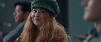 Movie still from “Clouds” (2020), directed by Justin Baldoni – A woman with long red hair wearing a green hat; Close Up shot, Over the shoulder angle
