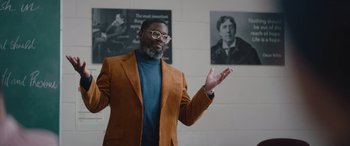 Movie still from “Clouds” (2020), directed by Justin Baldoni – A man wearing a brown jacket and glasses; Medium shot, Over the shoulder angle
