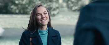 Movie still from “Clouds” (2020), directed by Justin Baldoni – A woman in a blue coat smiling at the camera; Close Up shot, Over the shoulder angle