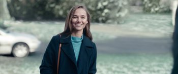 Movie still from “Clouds” (2020), directed by Justin Baldoni – A woman in a blue sweater and a black coat; Close Up shot, Over the shoulder angle