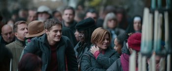 Movie still from “Clouds” (2020), directed by Justin Baldoni – A group of people standing around each other in a crowd; Medium shot, Over the shoulder angle