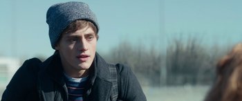 Movie still from “Clouds” (2020), directed by Justin Baldoni – A young man wearing a hat and a jacket; Close Up shot, Over the shoulder angle