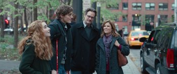 Movie still from “Clouds” (2020), directed by Justin Baldoni – A group of people standing next to each other on a sidewalk; Medium shot, Over the shoulder angle