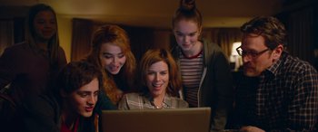 Movie still from “Clouds” (2020), directed by Justin Baldoni – A group of young women looking at a laptop; Medium shot, Low angle