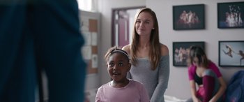 Movie still from “Clouds” (2020), directed by Justin Baldoni – A girl and a woman standing next to each other in a room; Medium shot, Over the shoulder angle