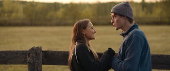 Movie still from “Clouds” (2020), directed by Justin Baldoni – A man and a woman standing next to each other on a field; Close Up shot, Over the shoulder angle