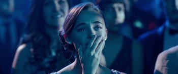 Movie still from “Clouds” (2020), directed by Justin Baldoni – A woman covering her mouth with her hands; Close Up shot, Over the shoulder angle