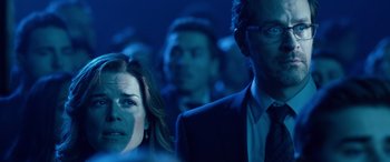 Movie still from “Clouds” (2020), directed by Justin Baldoni – A man and a woman are standing in a dark room; Close Up shot, Over the shoulder angle