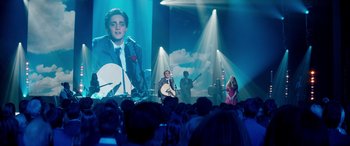 Movie still from “Clouds” (2020), directed by Justin Baldoni – A group of people in front of a large screen; Wide shot, Over the shoulder angle