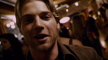 Movie still from “Cloverfield” (2008), directed by Matt Reeves – A person with a beard; Close Up shot, Low angle