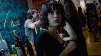 Movie still from “Cloverfield” (2008), directed by Matt Reeves – A woman standing next to a man in a room; Close Up shot, Over the shoulder angle