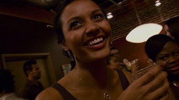 Movie still from “Cloverfield” (2008), directed by Matt Reeves – A person smiling; Close Up shot, Over the shoulder angle