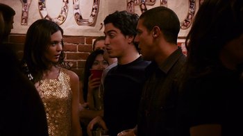 Movie still from “Cloverfield” (2008), directed by Matt Reeves – A group of people standing next to each other in a room; Medium shot, Over the shoulder angle