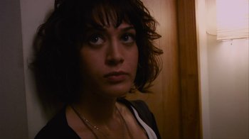Movie still from “Cloverfield” (2008), directed by Matt Reeves – A person wearing a necklace; Close Up shot, Low angle