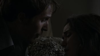 Movie still from “Cloverfield” (2008), directed by Matt Reeves – A man and a woman face to face in the dark; Close Up shot, Low angle