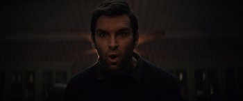 Movie still from “Cobweb” (2023), directed by Samuel Bodin – A person with his mouth wide open; Close Up shot, Low angle