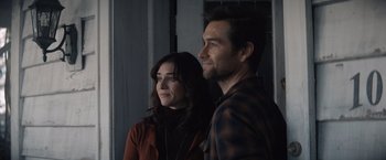 Movie still from “Cobweb” (2023), directed by Samuel Bodin – A man and a woman standing next to each other; Medium shot, Over the shoulder angle