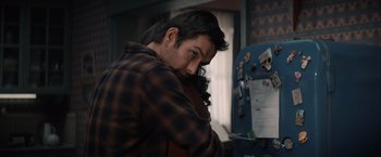 Movie still from “Cobweb” (2023), directed by Samuel Bodin – A man leaning against a wall looking at the camera; Close Up shot, Over the shoulder angle