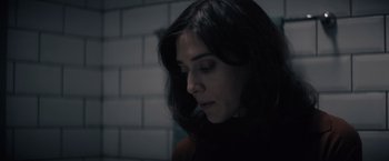 Movie still from “Cobweb” (2023), directed by Samuel Bodin – A person with long black hair; Close Up shot, High angle