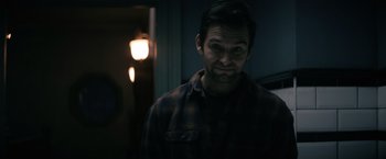 Movie still from “Cobweb” (2023), directed by Samuel Bodin – A person wearing a plaid shirt; Close Up shot, Over the shoulder angle