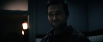 Movie still from “Cobweb” (2023), directed by Samuel Bodin – A person with a beard; Close Up shot, Over the shoulder angle