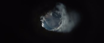 Movie still from “Cobweb” (2023), directed by Samuel Bodin – A person looking through a hole in a wall; Extreme Close Up shot, Overhead angle