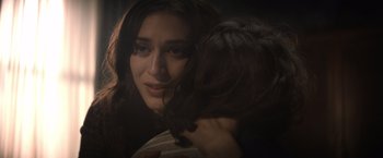 Movie still from “Cobweb” (2023), directed by Samuel Bodin – A person holding a cat; Close Up shot, Over the shoulder angle