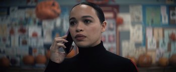 Movie still from “Cobweb” (2023), directed by Samuel Bodin – A woman in a black sweater talking on a cell phone; Close Up shot, Over the shoulder angle