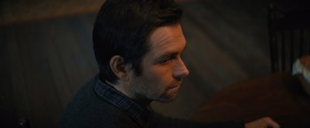 Movie still from “Cobweb” (2023), directed by Samuel Bodin – A person looking to the side; Close Up shot, Over the shoulder angle