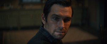 Movie still from “Cobweb” (2023), directed by Samuel Bodin – A person wearing a jacket; Close Up shot, Over the shoulder angle