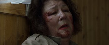 Movie still from “Cocaine Bear” (2023), directed by Elizabeth Banks – An older woman with blood all over her face; Close Up shot, Low angle