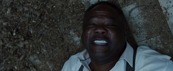 Movie still from “Cocaine Bear” (2023), directed by Elizabeth Banks – A person with his mouth open; Close Up shot, Overhead angle
