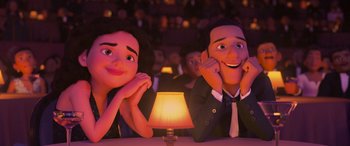 Movie still from “Coco” (2017), directed by Adrian Molina – A couple of people sitting at a table with a lamp in front of them; Close Up shot, Over the shoulder angle