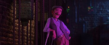 Movie still from “Coco” (2017), directed by Adrian Molina – A man with a cane standing next to a pole in a room; Medium shot, Low angle