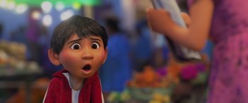 Movie still from “Coco” (2017), directed by Adrian Molina – A character's face in a scene; Close Up shot, Over the shoulder angle