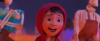 Movie still from “Coco” (2017), directed by Adrian Molina – A woman with a red hooded jacket is smiling for the camera; Close Up shot, Low angle