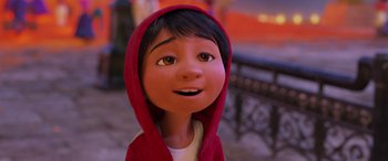 Movie still from “Coco” (2017), directed by Adrian Molina – A cartoon of a person wearing a red hooded jacket; Close Up shot, Low angle