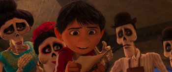 Movie still from “Coco” (2017), directed by Adrian Molina – A young boy is holding a piece of paper; Close Up shot, Over the shoulder angle
