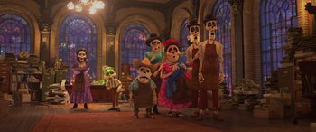 Movie still from “Coco” (2017), directed by Adrian Molina – A group of people standing next to each other in a room; Wide shot, Low angle